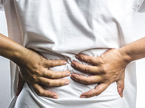 victim of auto accident injuries in Sacramento suffering from back pain