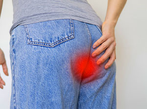 victim of auto accident injuries in Sacramento suffering from tailbone pain