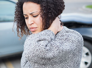 victim of auto accident injuries in Sacramento suffering from whiplash